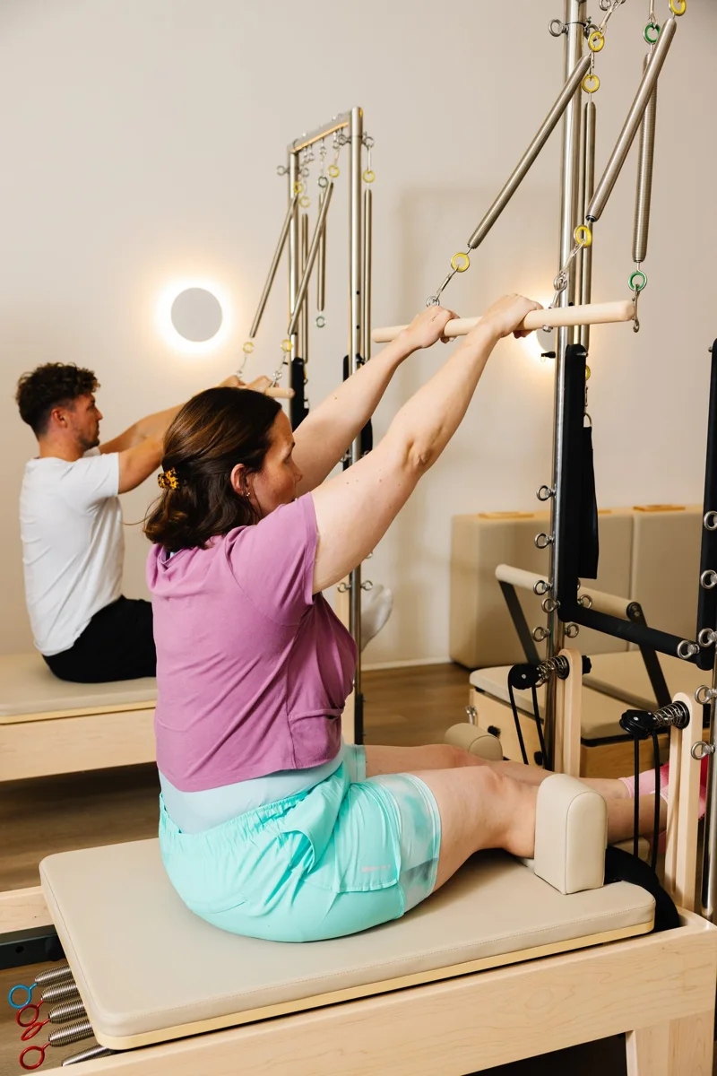 A seated Tower exercise with the spring bar
