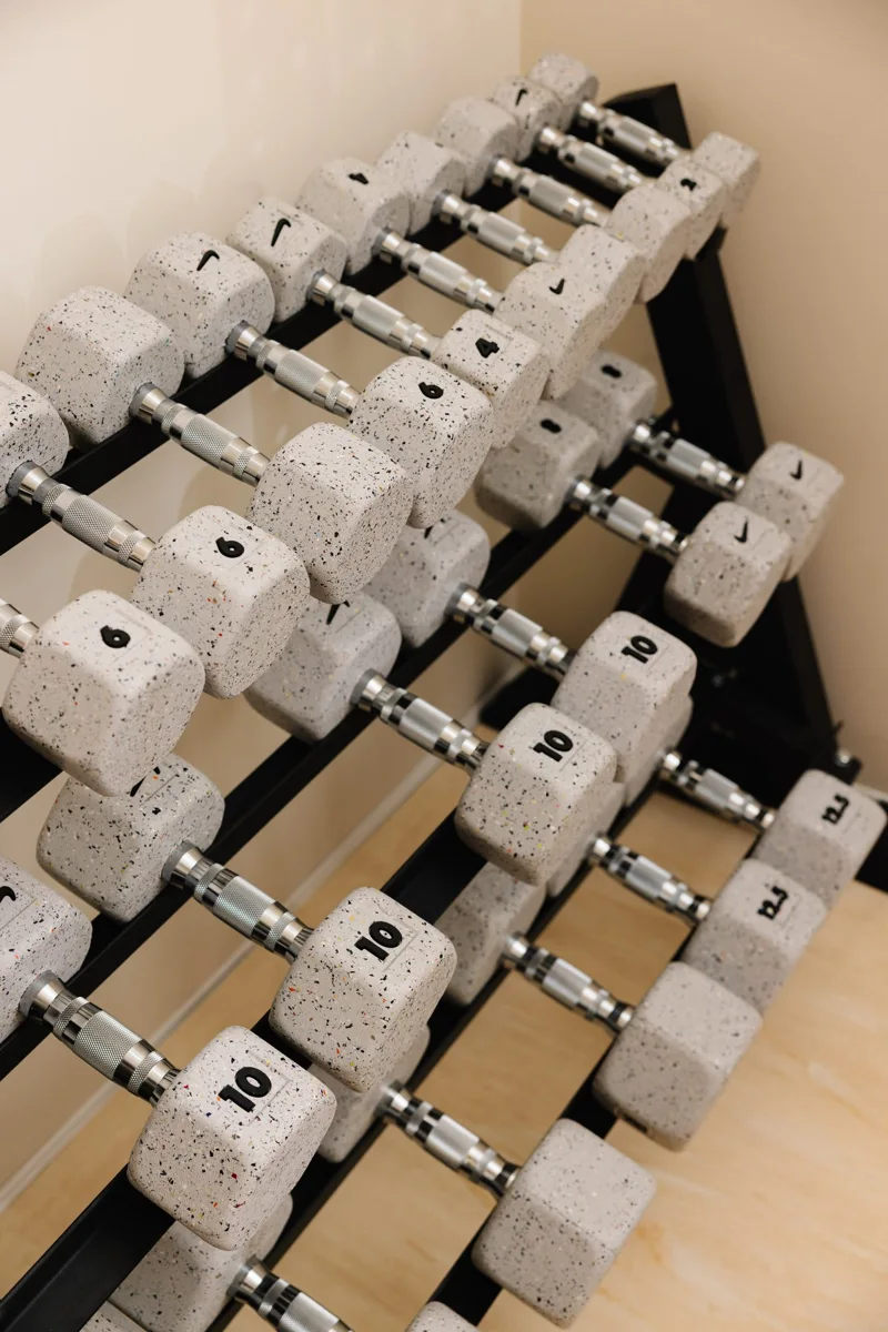Dumbbells arranged by weight in the Strength Lab