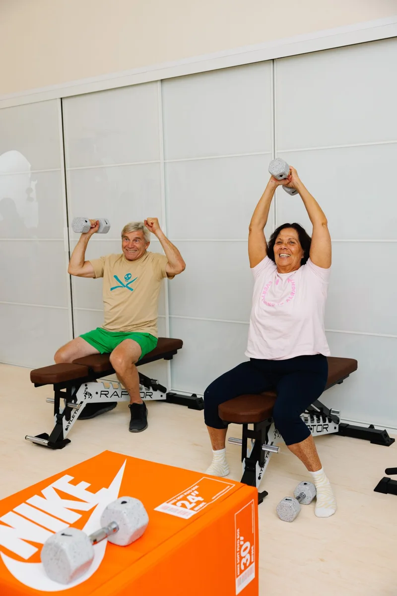 A seated overhead press in the Strength Lab